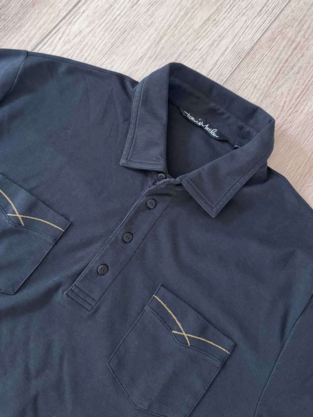 Travis Mathew Black Polo with Contrast Stitching